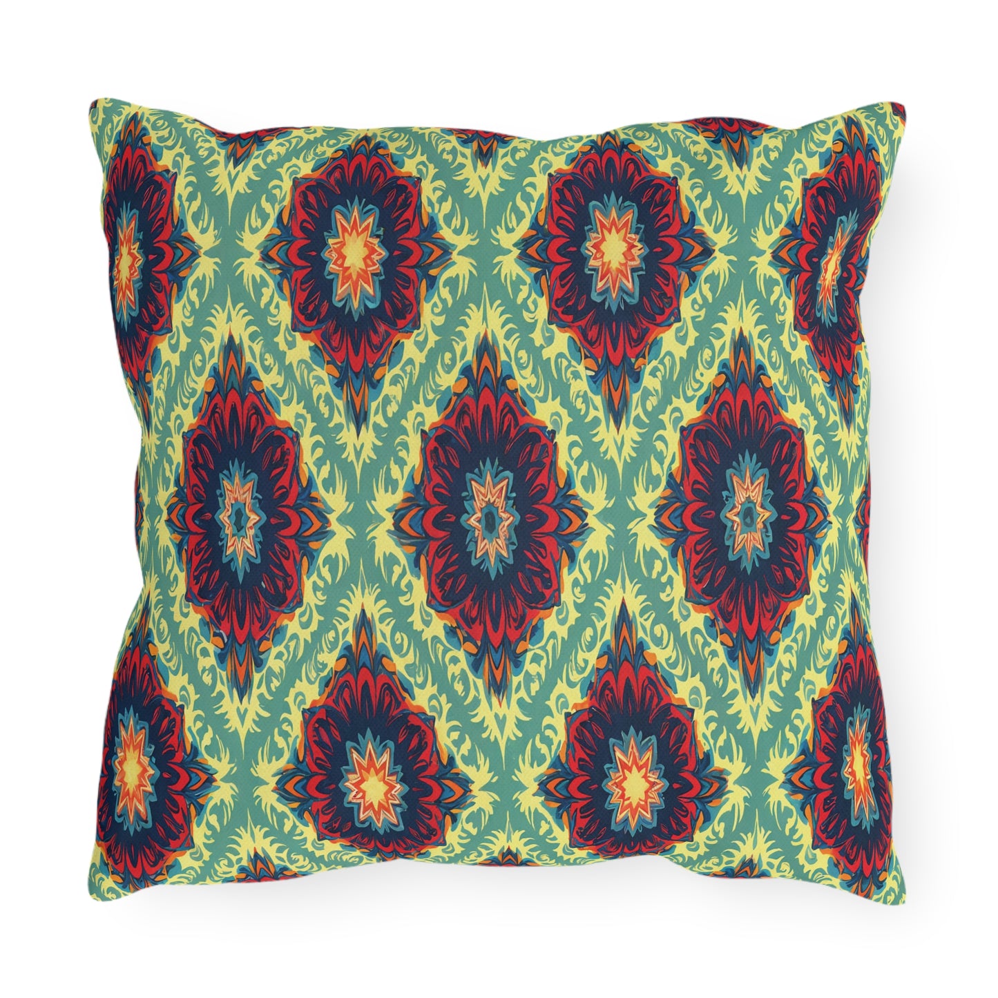 A rectangular pillow with a colorful, symmetrical, African-inspired floral pattern. The design features red, orange, and dark blue flower-like shapes with yellow accents on a light green background, arranged in a repeating diamond layout.