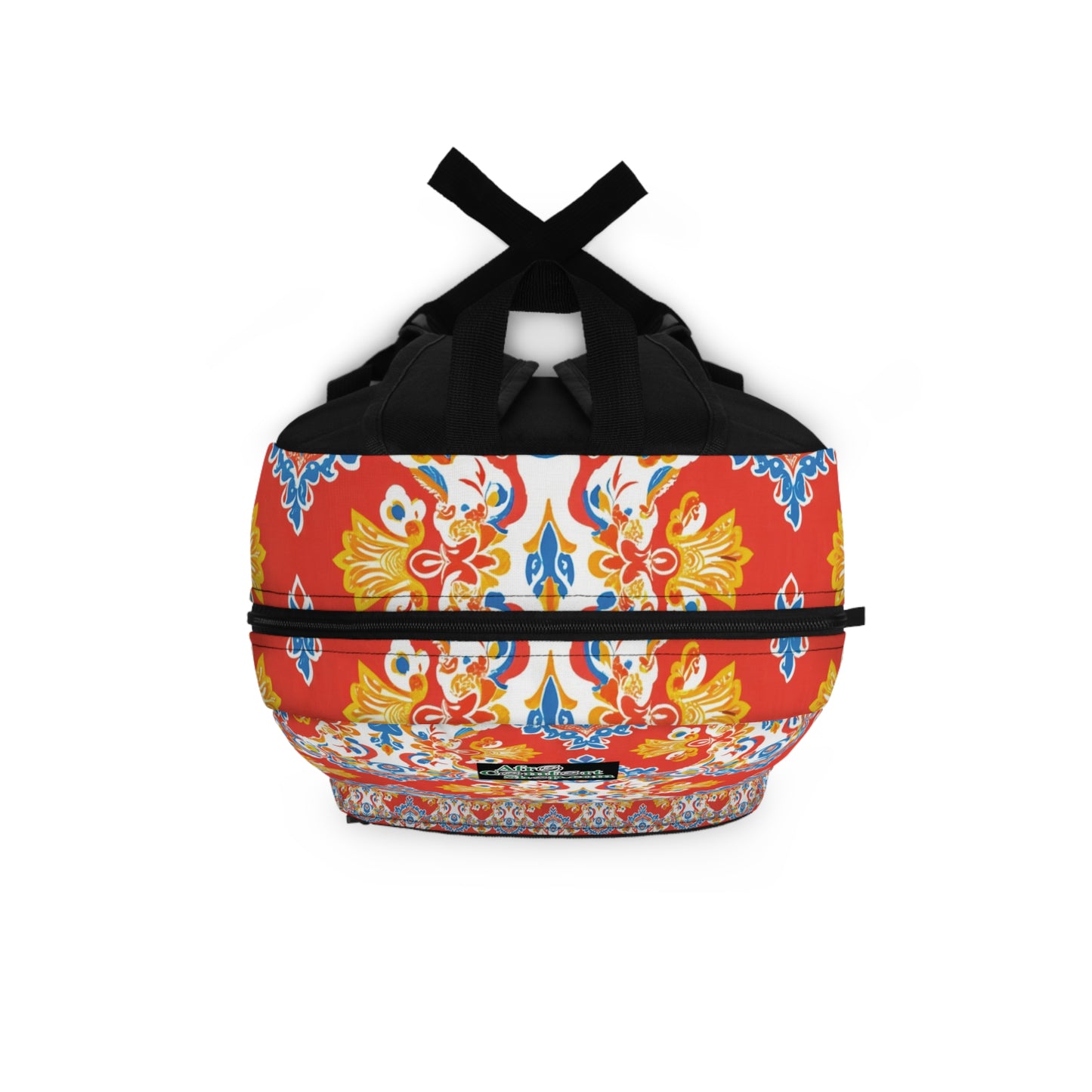 This boho chic rucksack features black handles and straps, adorned with a vibrant pattern of yellow, blue, and red ornate floral and geometric designs on a white and red background, creating a symmetrical look that covers the entire bag.