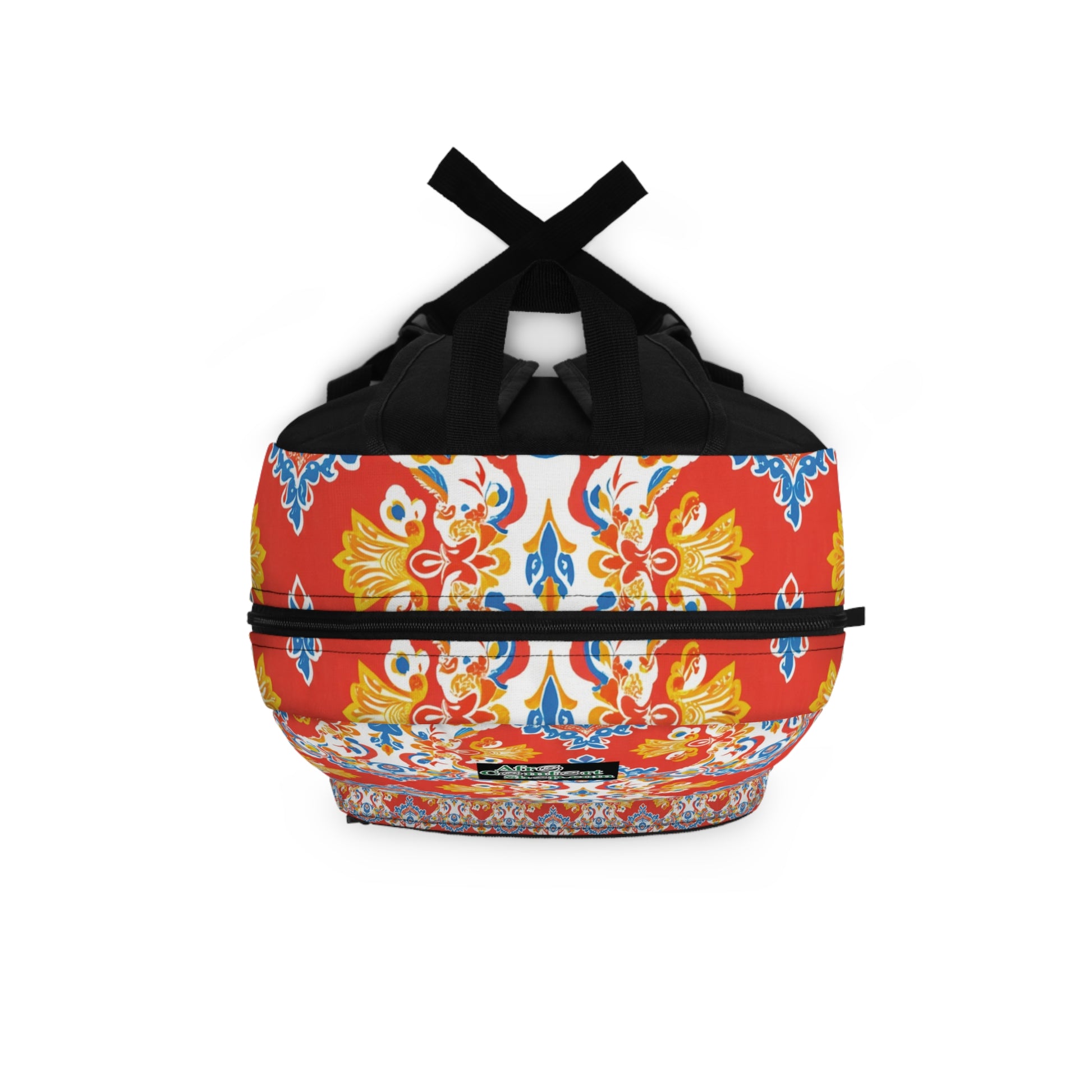 This boho chic rucksack features black handles and straps, adorned with a vibrant pattern of yellow, blue, and red ornate floral and geometric designs on a white and red background, creating a symmetrical look that covers the entire bag.