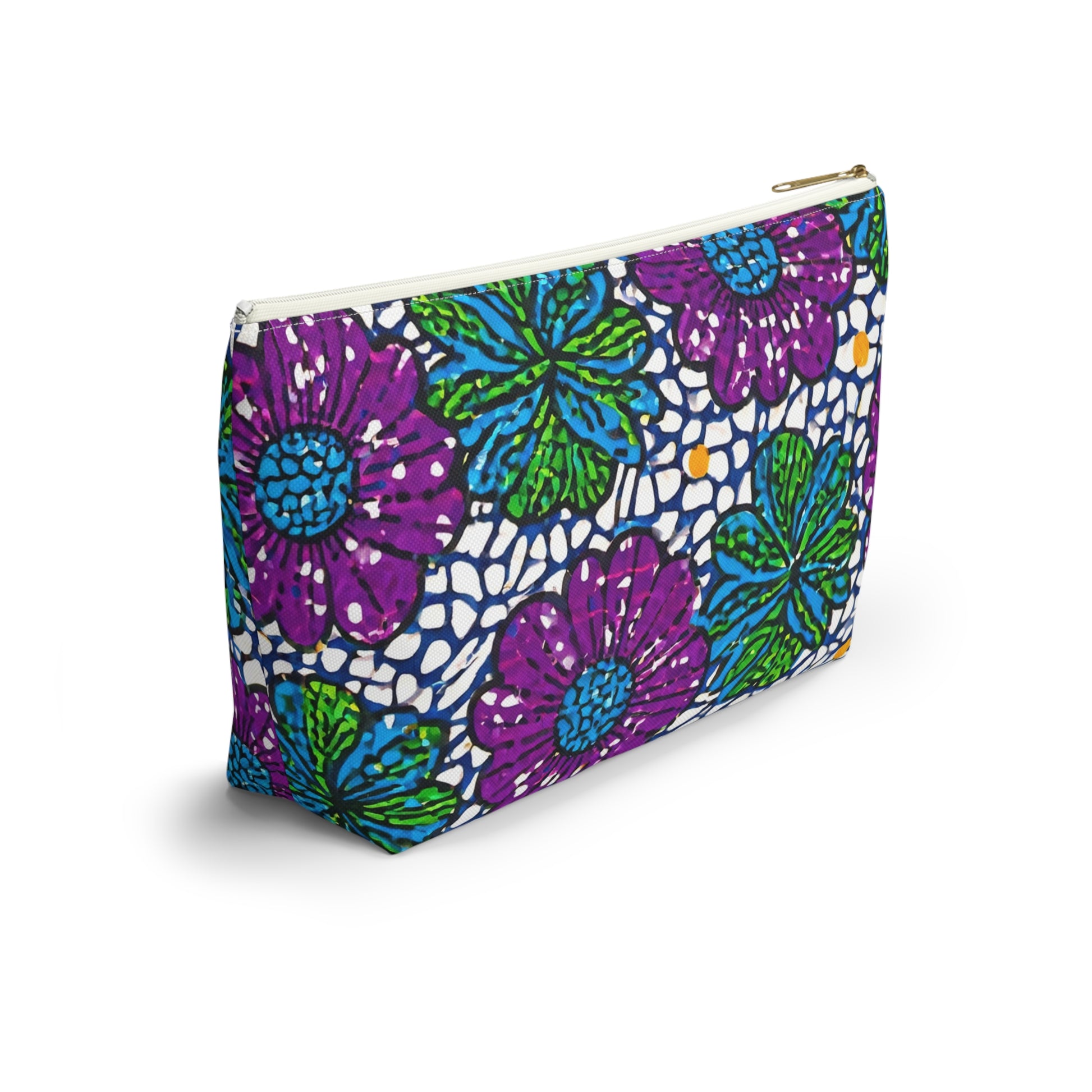 A zippered T-bottom pouch stands upright, decorated with a bold floral pattern inspired by African-inspired patterns in purple, blue, and green. This vibrant cosmetic travel bag features dark blue outlines and scattered yellow dots for an artistic touch.