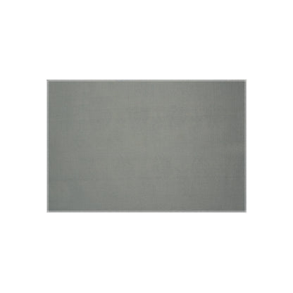 A rectangular, flat, light gray rug with a subtle African-inspired woven texture, placed on a white background. The rug has clean, straight edges and appears thin and even in color, with no visible patterns or designs.