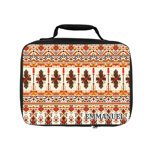 A rectangular, African-inspired lunch bag with a black handle and zipper. The insulated lunch tote features orange, brown, and cream geometric and floral motifs, with “EMMANUEL” printed in black and white on the lower right corner.