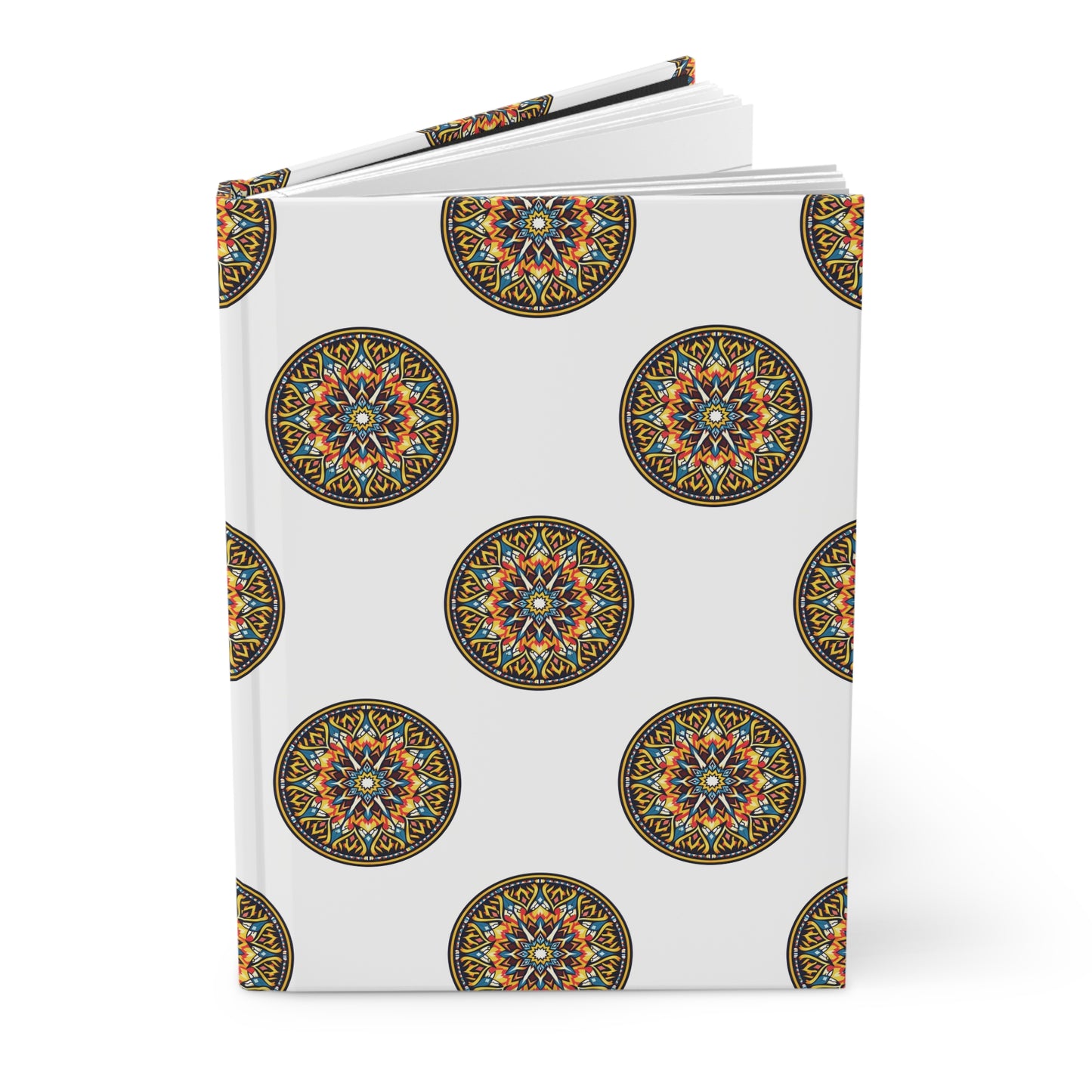 A hardcover journal with a white cover featuring a repeating pattern of intricate, colorful circular mandalas in orange, blue, yellow, and black. The book is slightly open and stands against a plain white background.