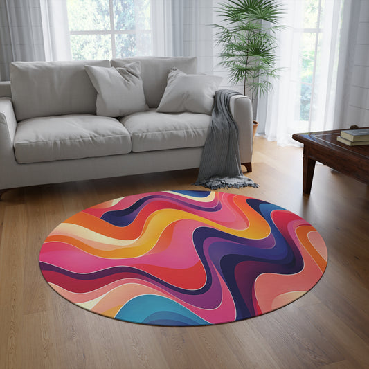 A modern living room with a light gray sofa, wooden coffee table, tall potted plant, and an African-inspired round rug featuring bold, wavy patterns in vibrant red, orange, pink, blue, and purple. Sheer curtains let in natural light.