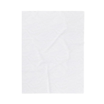 A single sheet of plain white paper towel lies flat against a white background. The towel has subtle embossed patterns, giving it texture—much like the details on an African-inspired blanket—while its clean, minimal look remains untouched.