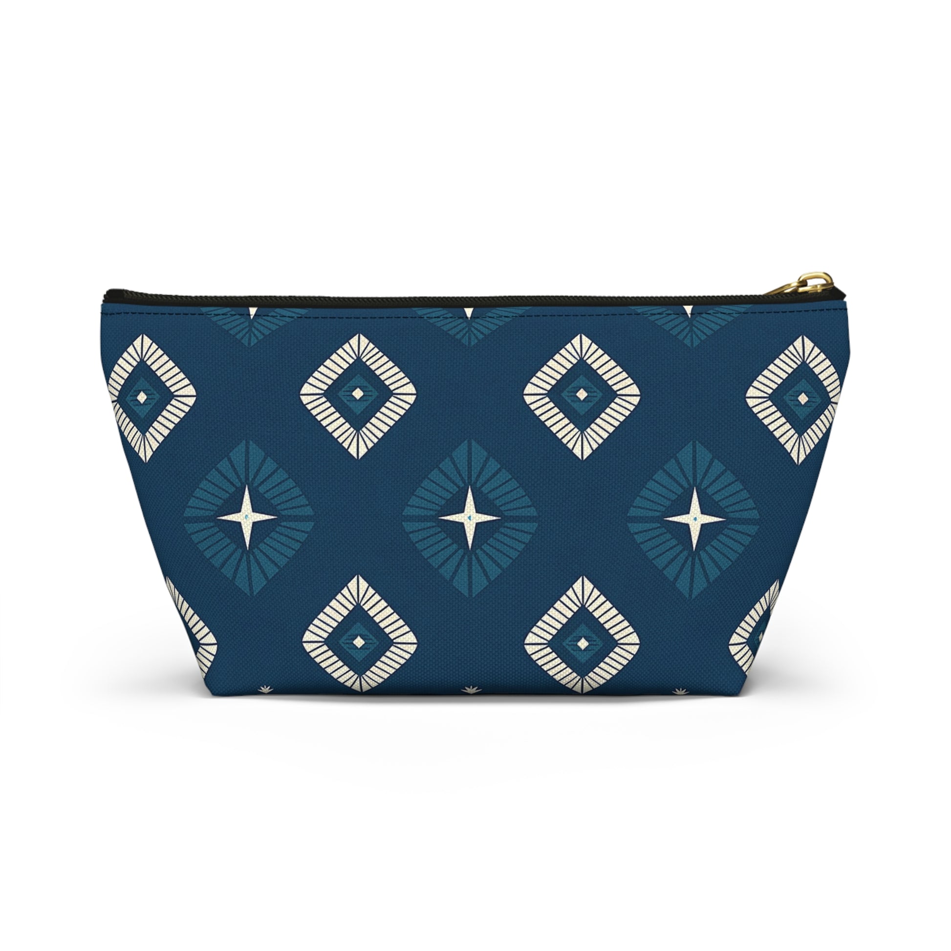 A T-bottom pouch with a geometric diamond pattern in teal, navy blue, and white. The African-inspired patterns feature starburst centers and radiating lines on a deep blue background. Gold zipper hardware lets this cosmetic travel bag stand upright.