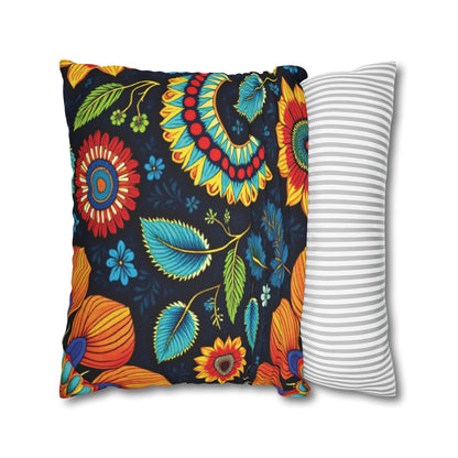 Two square pillows are shown. The left pillow features African-inspired patterns with bright, colorful florals on a dark background. The right pillow has a simple design with horizontal gray and white stripes, both set against a white background.