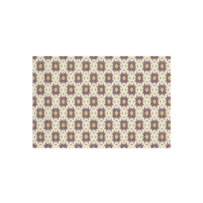 A repeating pattern of African-inspired purple and yellow floral motifs with green accents, arranged in evenly spaced rows and columns on a beige background, creating a decorative, symmetrical, vintage-style design.
