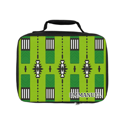 A bright green African-inspired lunch bag with a black handle features geometric patterns in black, white, and dark green. Rectangles, triangles, and zigzags decorate the insulated lunch tote with “EMMANUEL” printed boldly in white on the lower right corner.