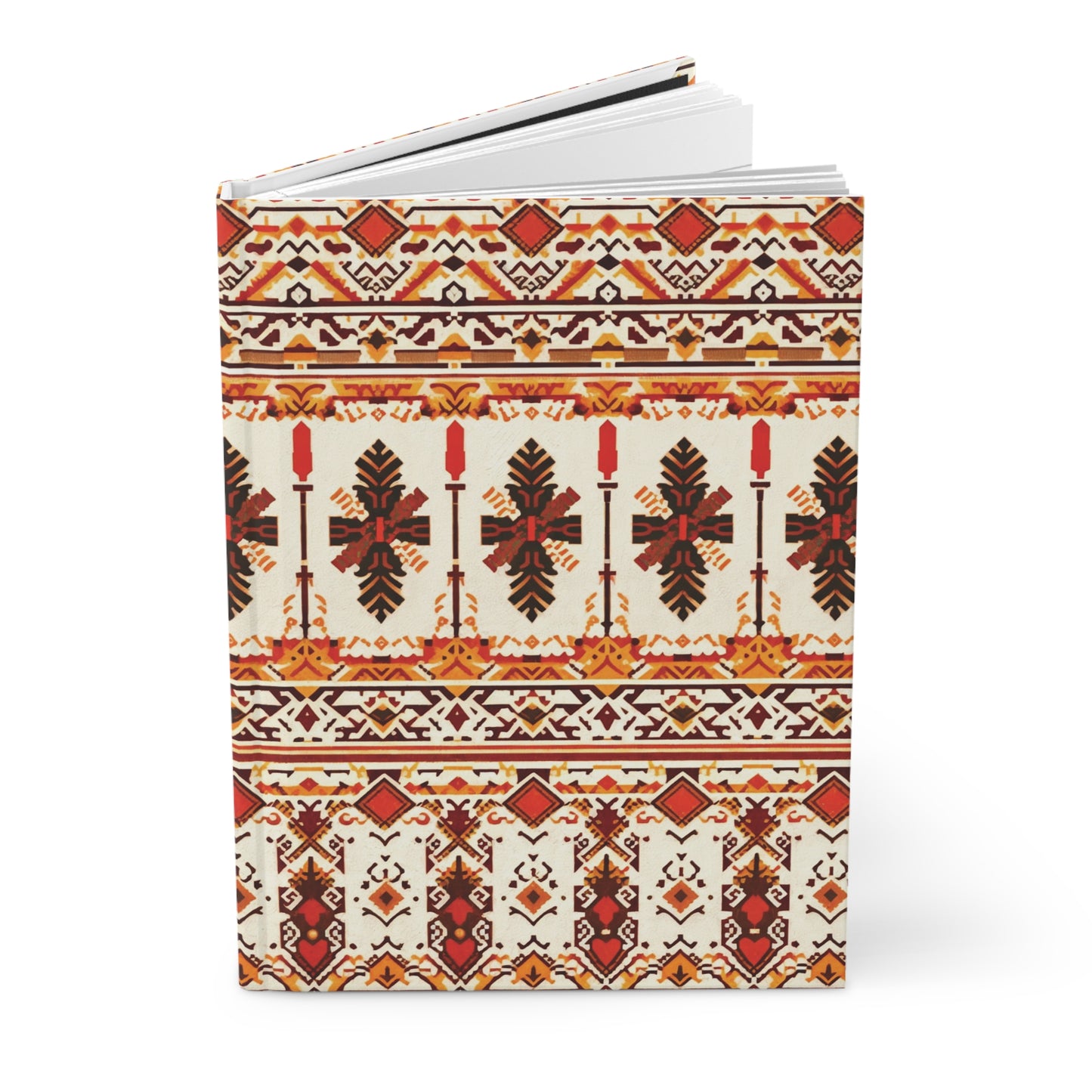 A hardcover journal featuring intricate, symmetrical folk-inspired patterns in red, orange, black, and yellow tones. The African-inspired design includes geometric shapes, crosses, stylized leaves, and repeating horizontal bands on a cream background.