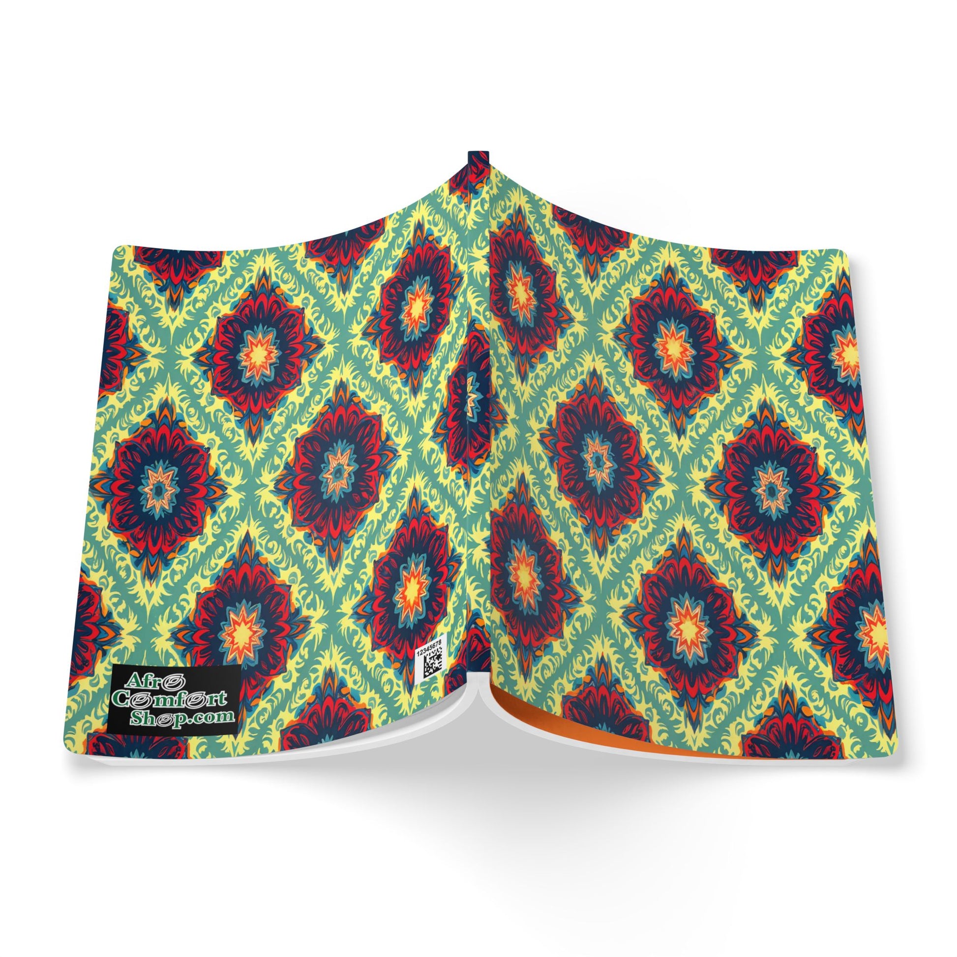 An open book cover displays a vibrant, symmetrical pattern of red, blue, and orange floral medallions on a light green background. This African-inspired journal features repeating diamond shapes and a “Covert Covers” logo at the bottom left corner.