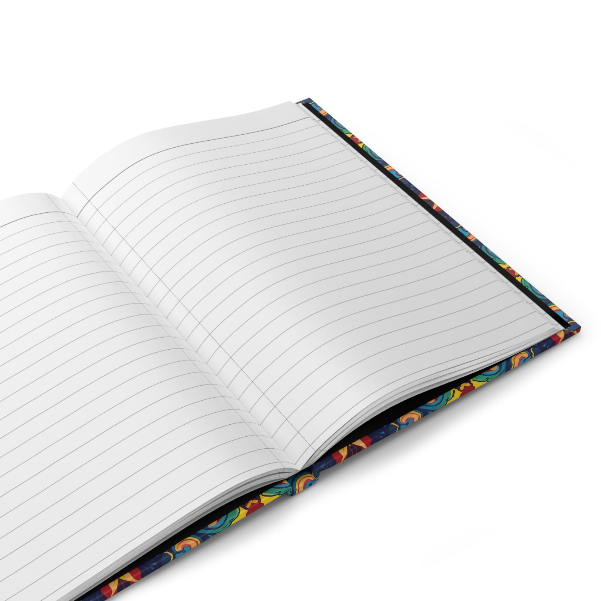 An open African-inspired journal with white, lined pages and a colorful, patterned cover featuring abstract designs. Resting on a white surface, the spine and part of the vibrant pattern are visible along the edges.