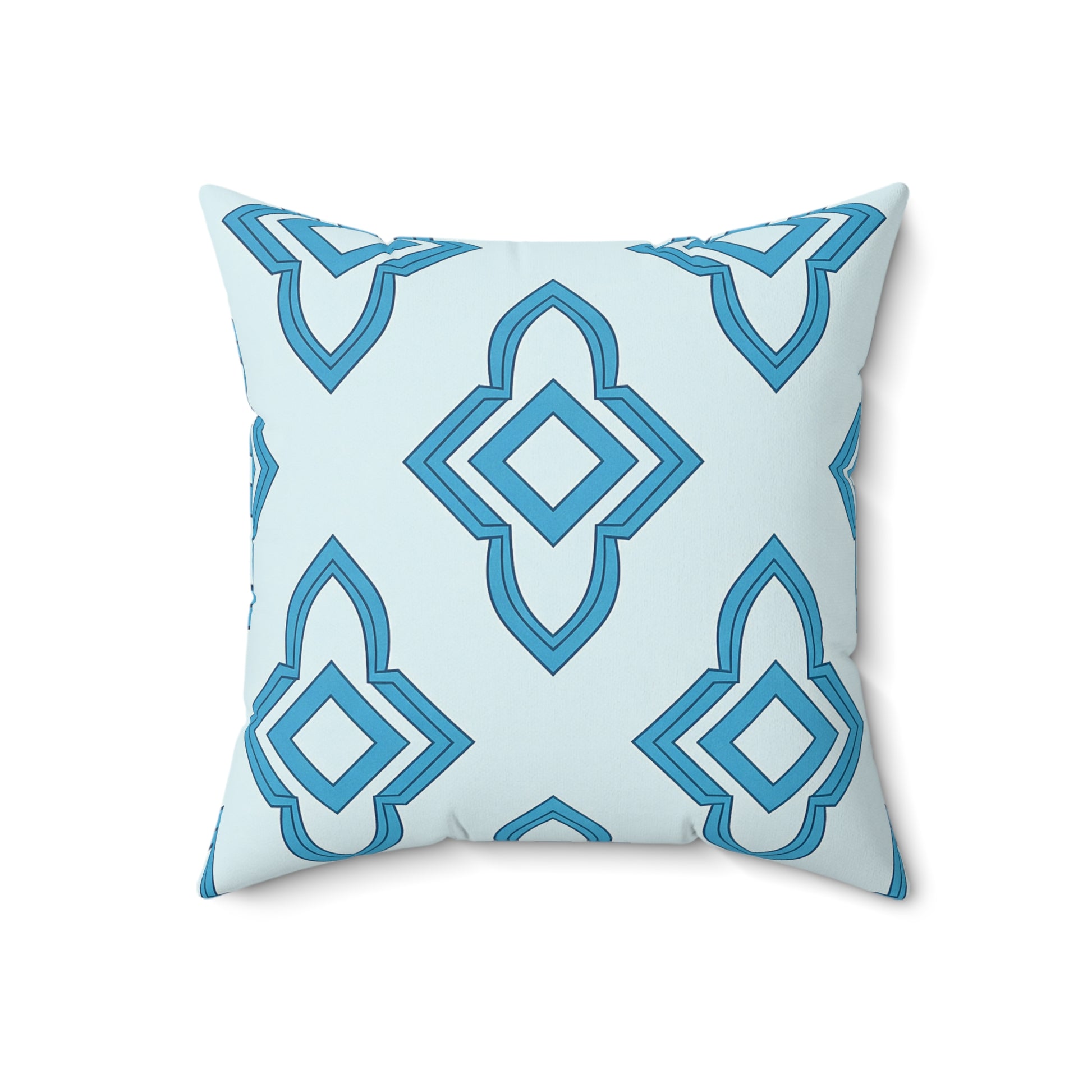 A square faux suede pillow with a light blue background features a repeating geometric pattern of layered diamond and pointed shapes in various shades of blue. The pillow is shown facing forward on a white background.