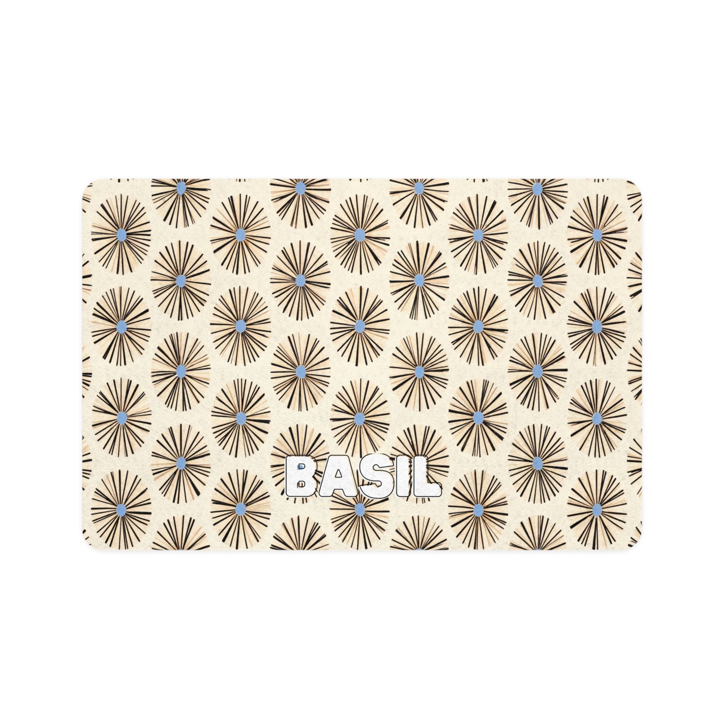 A beige card with repeating brown geometric sunburst patterns featuring small blue centers. The African-inspired design highlights the word BASIL in bold white uppercase letters near the bottom center of the card.