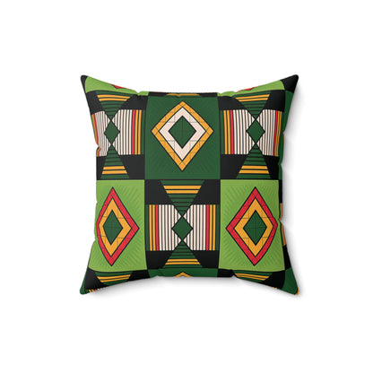 Square faux suede pillow featuring a bold, African inspired geometric pattern in green and black, yellow, and red diamond shapes with striped rectangles, all arranged symmetrically on a white background.