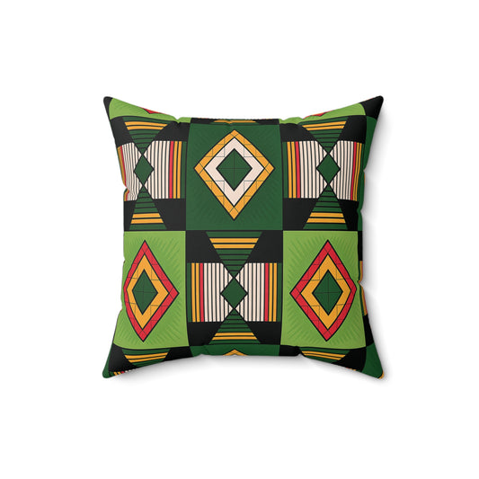 Square faux suede pillow featuring a bold, African inspired geometric pattern in green and black, yellow, and red diamond shapes with striped rectangles, all arranged symmetrically on a white background.