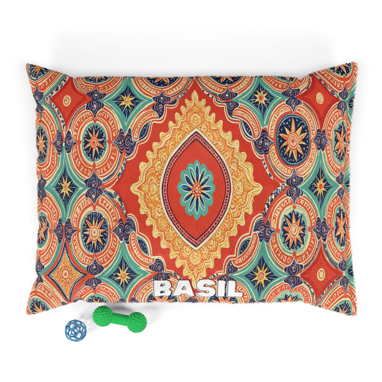 A cozy pet pillow featuring a vibrant, multicolored mandala pattern and “BASIL” in white at the bottom center. Two dog toys—a blue ball and green bone—add playful charm to this stylish pet bed on a crisp white background.