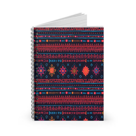 A spiral-bound, African-inspired spiral notebook with a dark cover featuring vibrant, geometric folk patterns in red, orange, pink, and blue. Rows of abstract symbols, diamond shapes, and floral motifs adorn this premium writing notebook with lined pages inside.