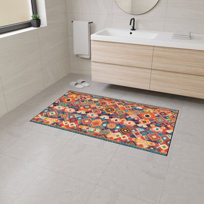 A modern bathroom with light beige tiles, a floating wooden vanity with a white sink, a round mirror, and an African-inspired geometric rug featuring custom floor mats and non-slip rubber backing. A towel hangs by the sink, and slippers rest under a large window.