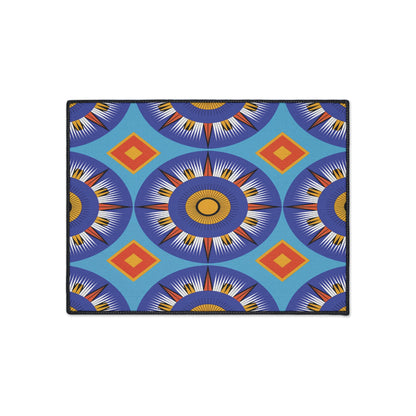 A rectangular mat with a vibrant geometric pattern featuring large circular sunburst shapes in blue, orange, and white channels African-inspired aesthetics. Diamond shapes in orange and yellow complete the bold, symmetrical look on this custom floor mat.