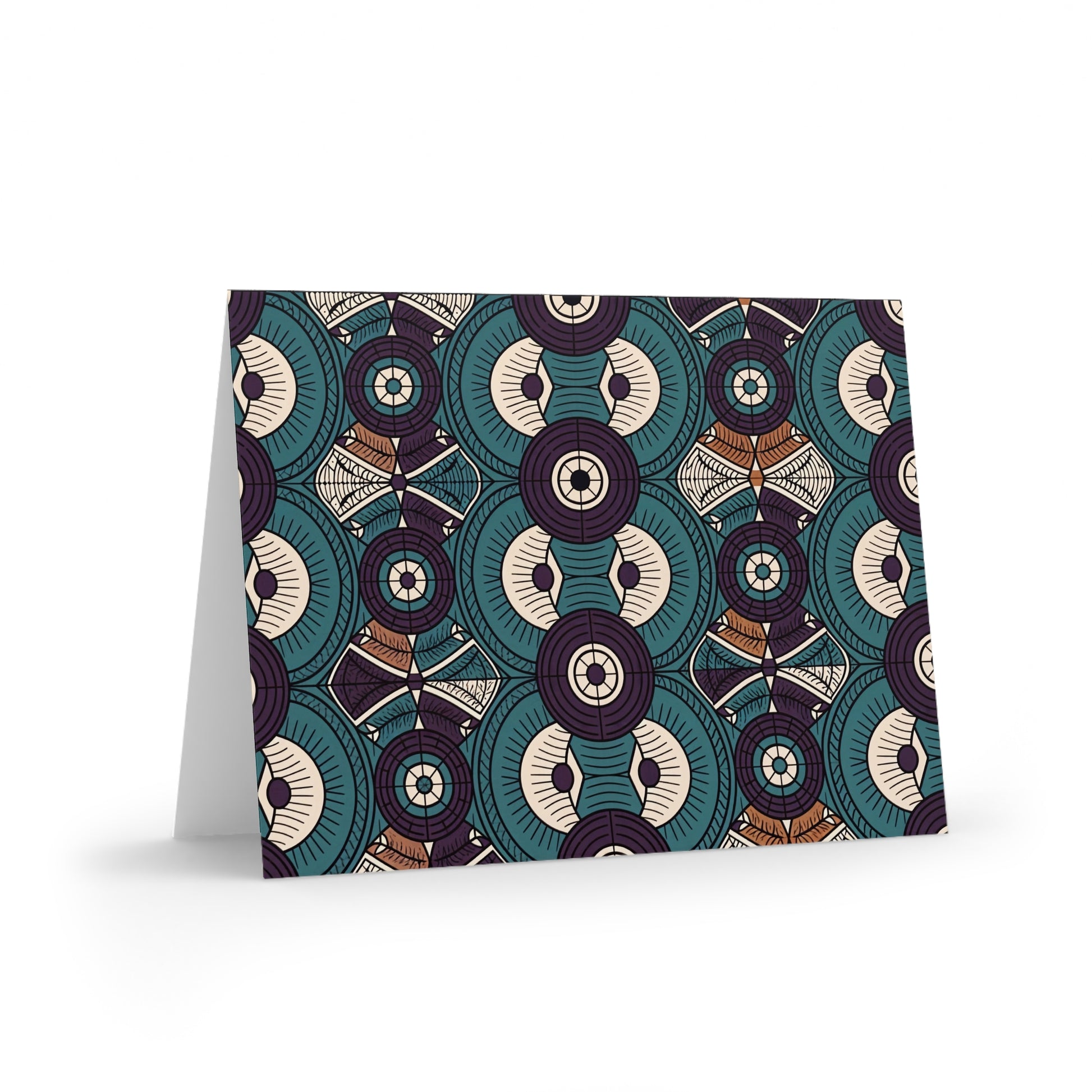 A greeting card with a bold, geometric pattern of overlapping teal, cream, brown, and purple shapes in a symmetrical design. Perfect for lovers of African-inspired greeting cards, the card is blank inside and stands upright on a white surface.
