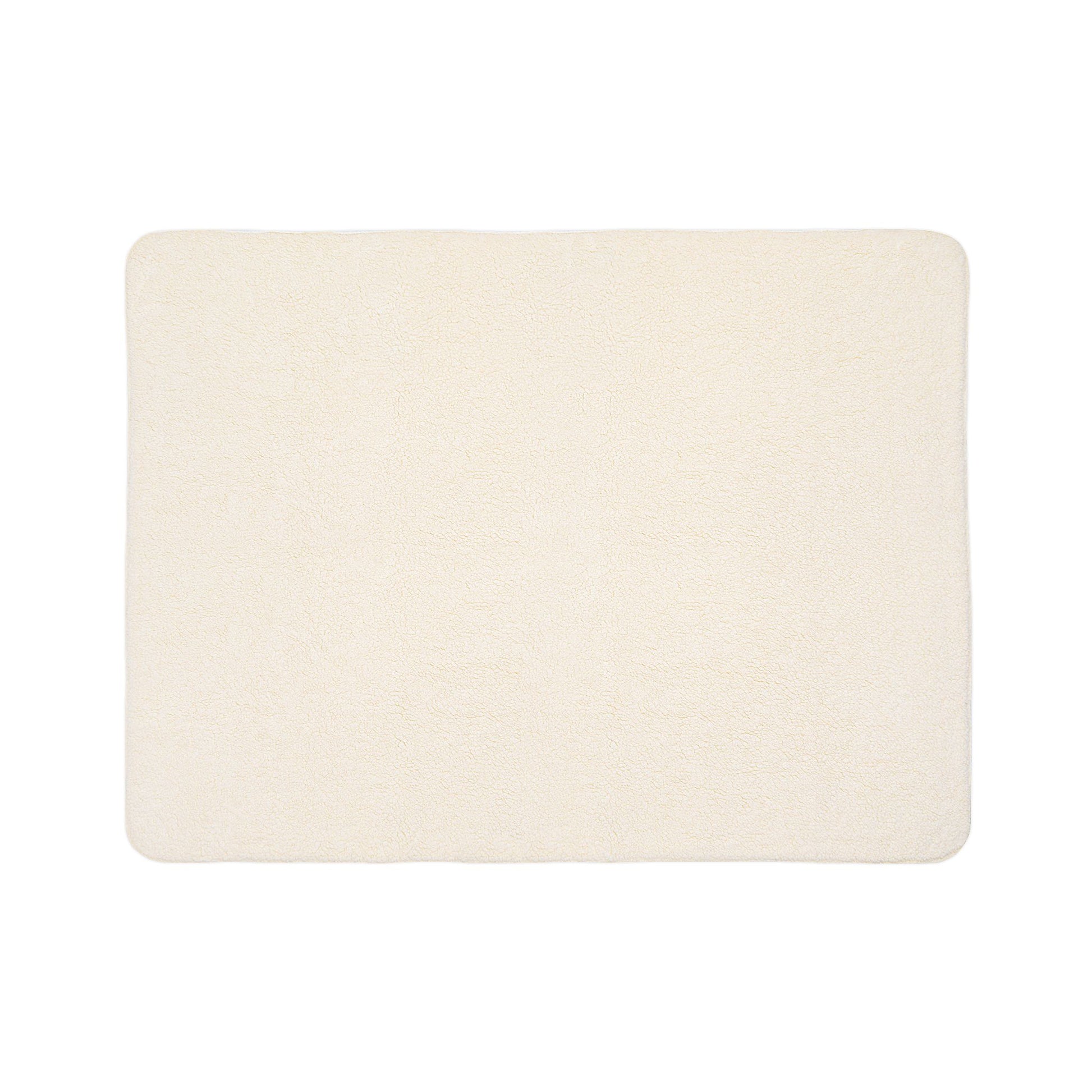 A rectangular, cream-colored bath mat with a soft, plush texture reminiscent of sherpa fleece. The edges are slightly rounded, and the surface appears smooth and uniform. The mat is photographed on a plain white background.