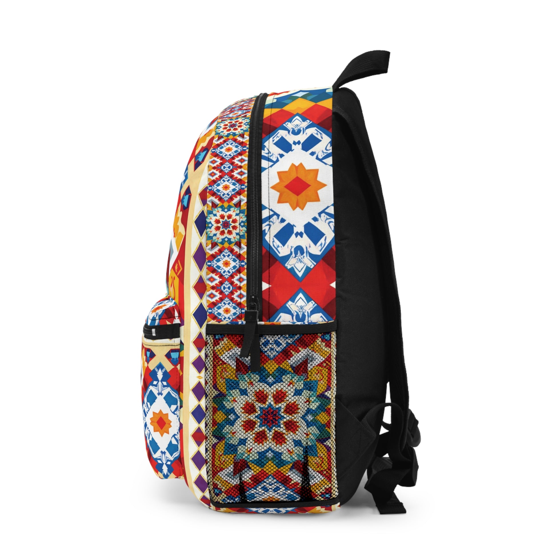 A vibrant patterned backpack shown from the side features geometric patterns in red, blue, yellow, and white. Inspired by traditional tile motifs with star and diamond shapes, this boho chic rucksack has a front pocket and sleek black straps.