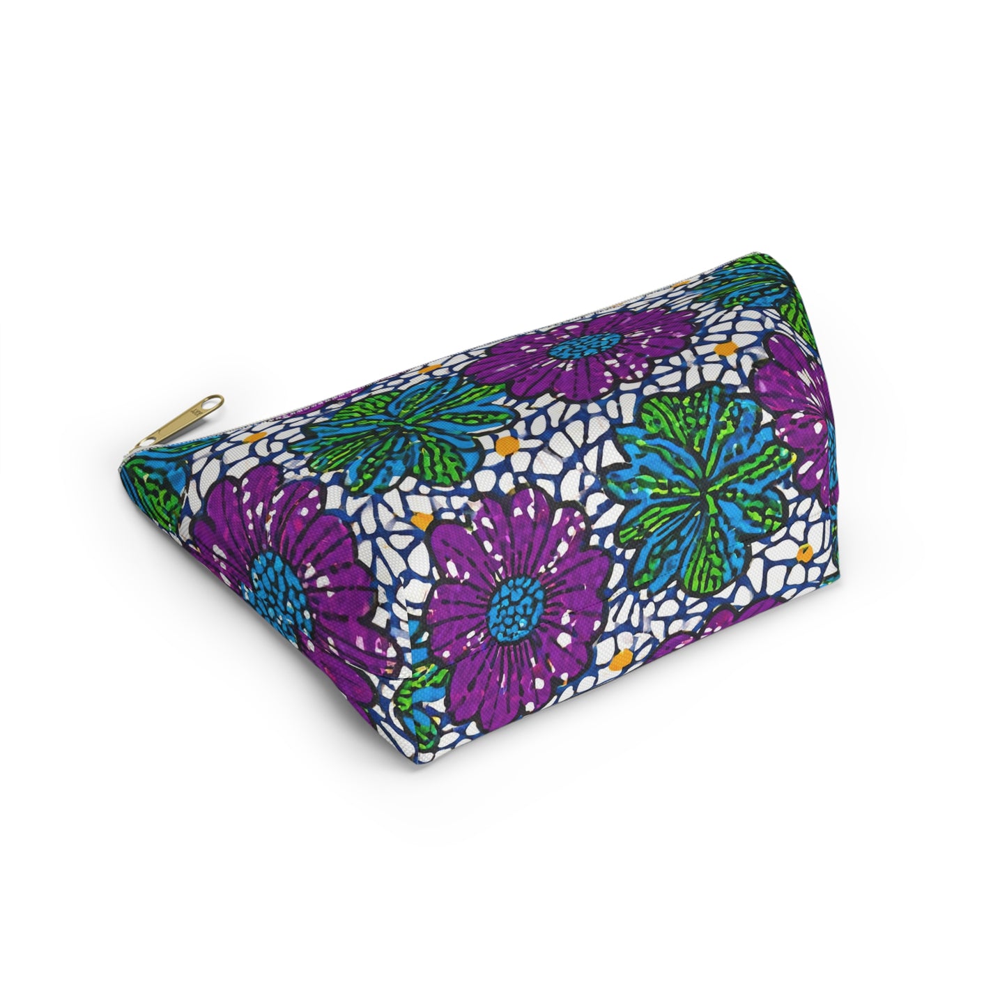 A colorful triangular cosmetic travel bag with African-inspired patterns in purple, green, and turquoise on a white background, featuring a gold zipper. The pouch sits on a white surface, highlighting its vibrant design and fabric texture.