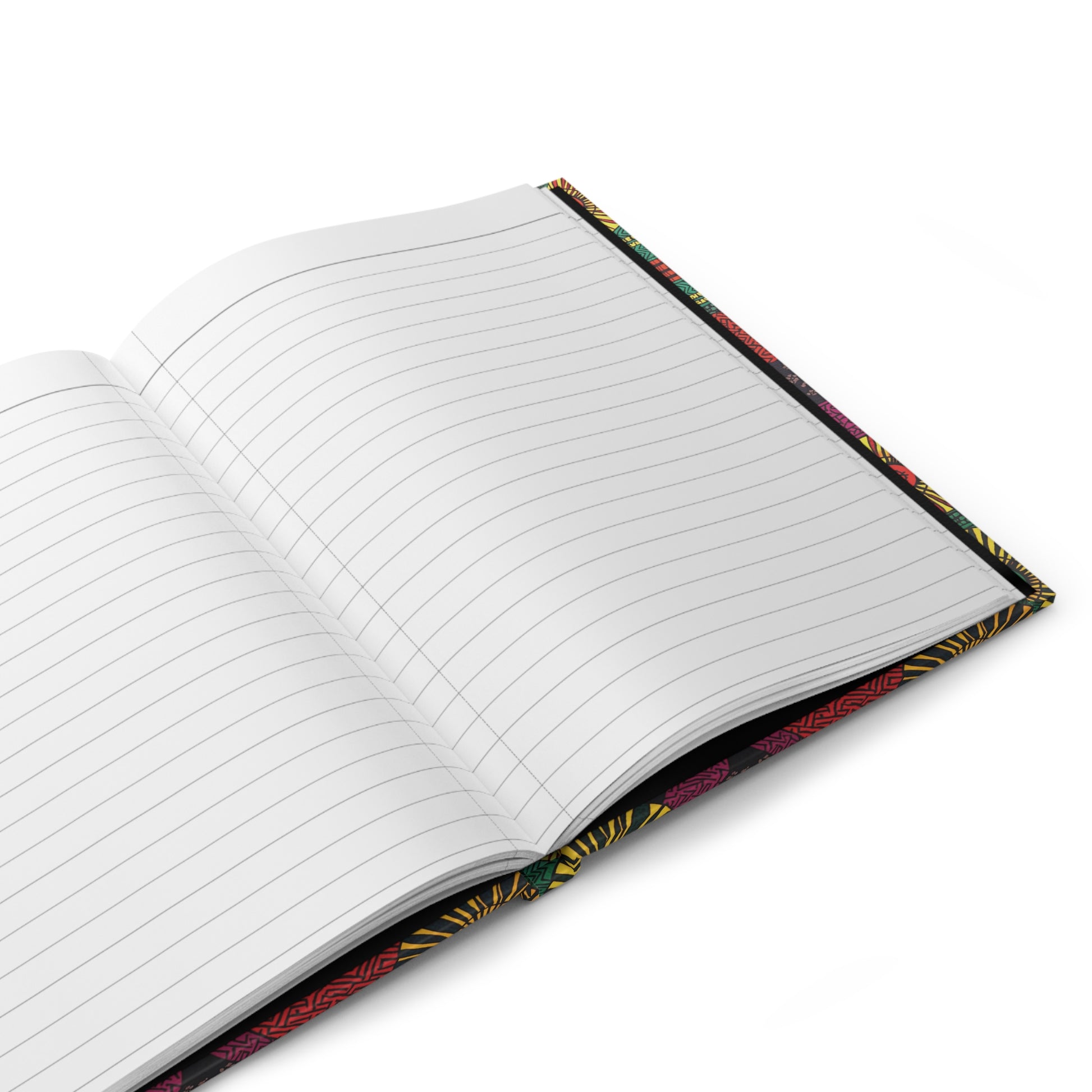 An open, lined African-inspired hardcover journal with a colorful, patterned cover sits on a white surface. The blank pages are ready for writing, and the edges reveal hints of yellow, red, and green designs.