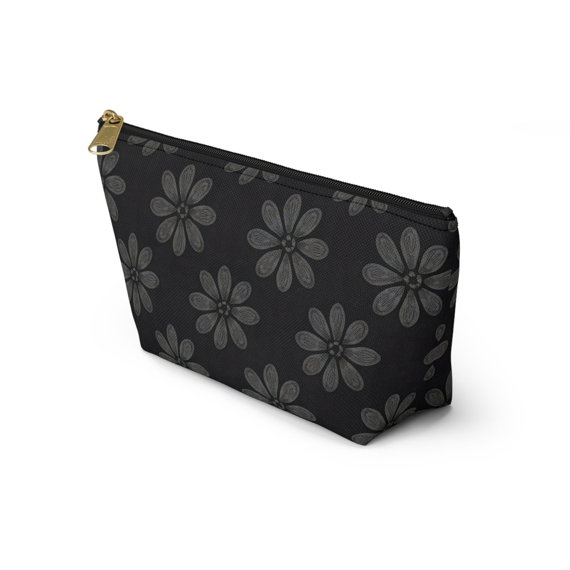 A black T-bottom pouch with a gold zipper pull, decorated with gray, hand-drawn flowers in African-inspired patterns. It stands upright on a white background, angled to show its front and left side—perfect as a stylish cosmetic travel bag.