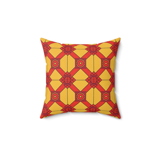 A square African inspired accent pillow with a geometric pattern in red and yellow. Interlocking squares, hexagons, and circles outlined in black create a symmetrical, visually striking look against a white background.