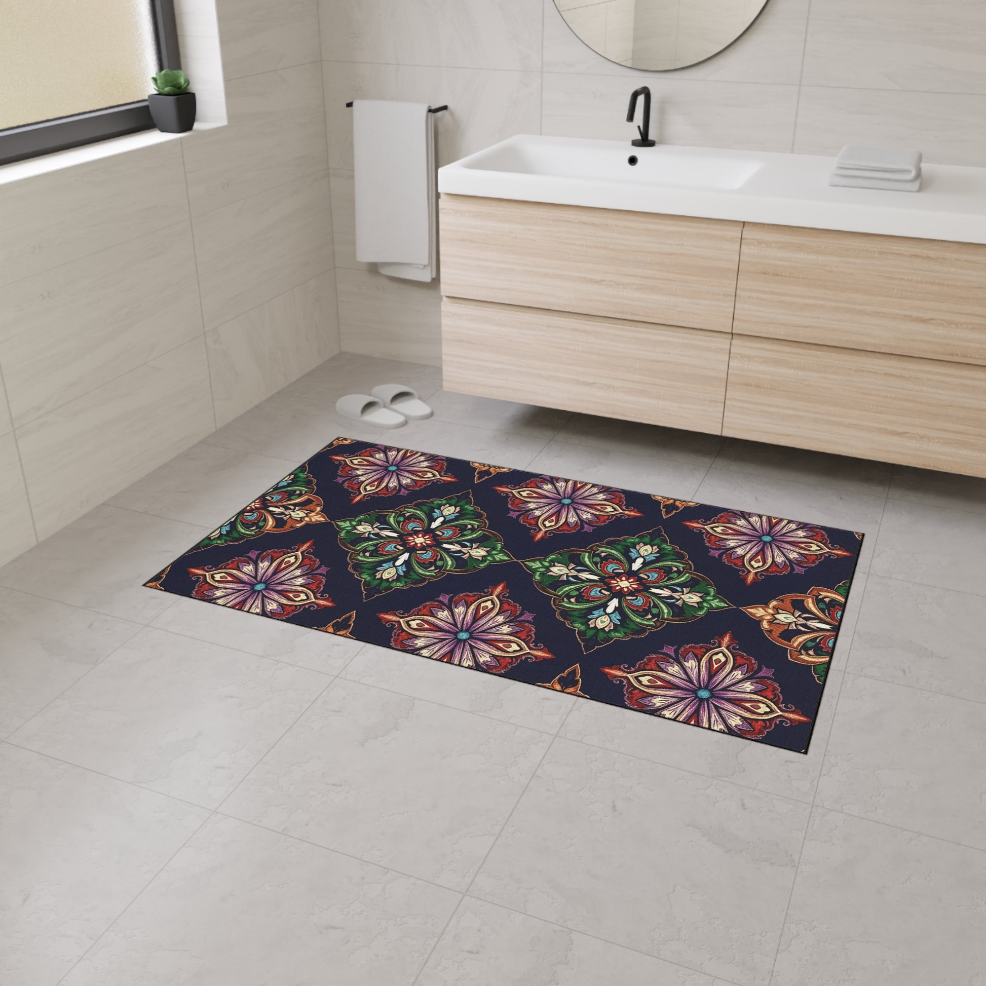 A modern bathroom with light beige tiles, a wooden vanity, and a round mirror. The colorful rectangular rug features ornate floral and geometric patterns inspired by African-inspired aesthetics on a dark background.