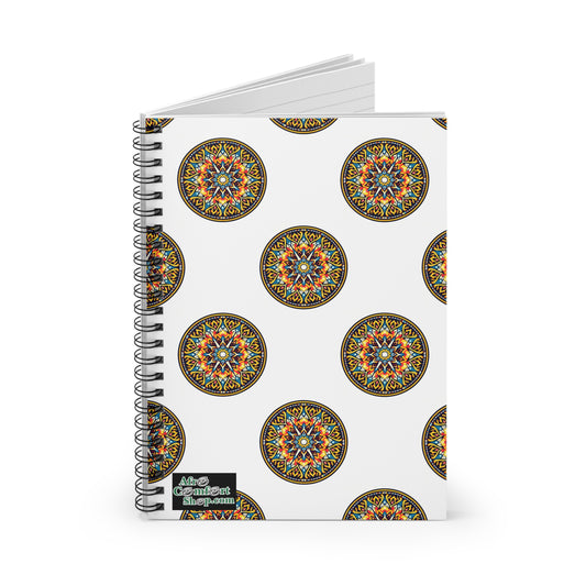 A spiral notebook with a white cover featuring vibrant, intricate mandala designs inspired by African art. The bottom left corner has a small label with “Afro Continent Shop.” The notebook is slightly open, revealing lined pages inside.