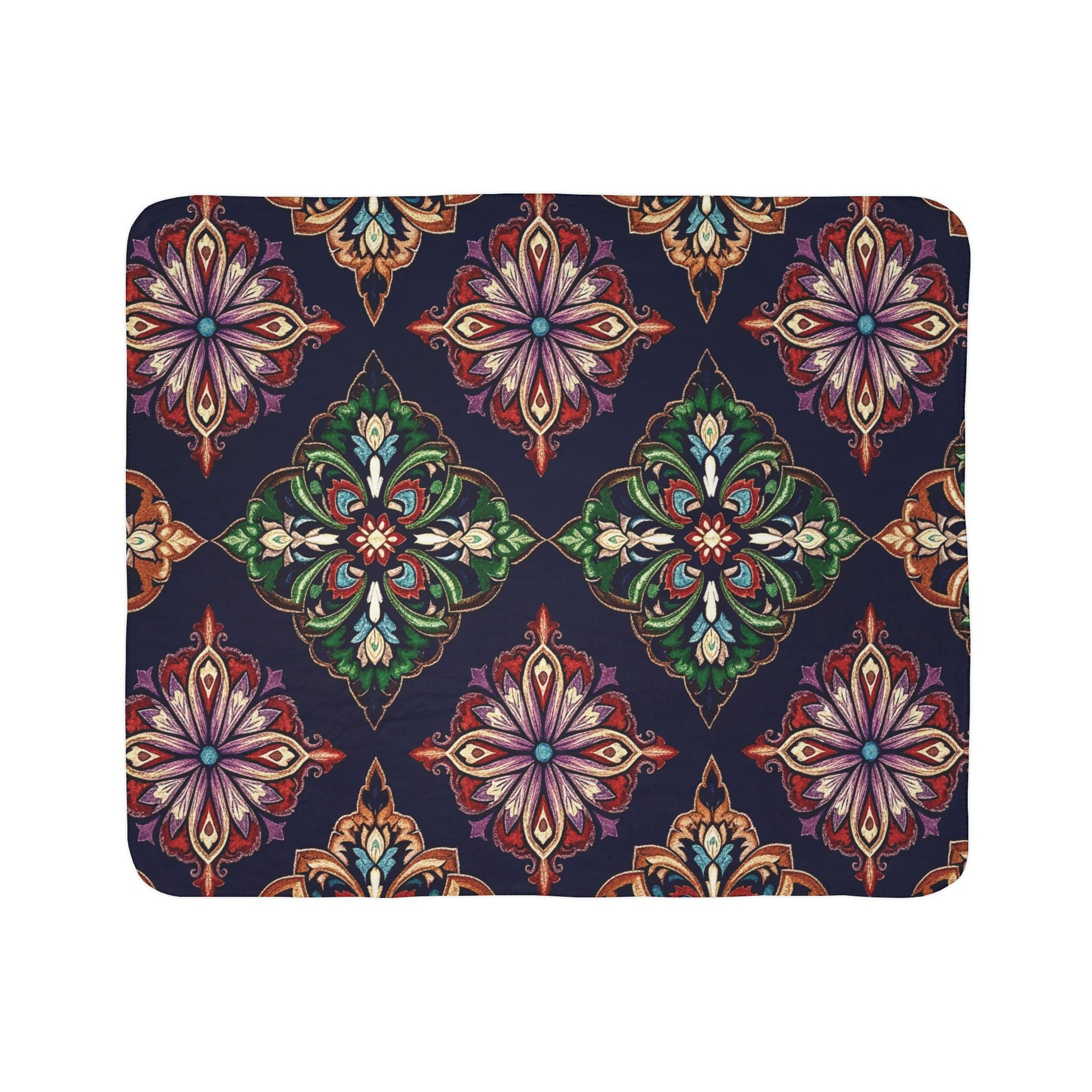 A rectangular sherpa fleece blanket featuring ornate, symmetrical floral motifs in red, green, gold, purple, and white on a dark blue background. The kaleidoscopic designs create cozy home decor with evenly spaced rows.
