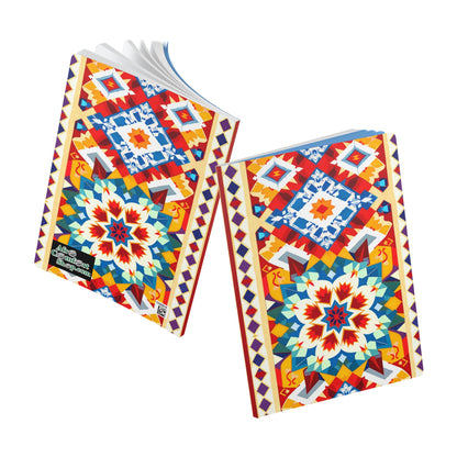 Two notebooks with vibrant, geometric covers feature symmetrical, colorful patterns in red, blue, yellow, and orange—perfect for a creative journal or daily journaling. Their mosaic-inspired designs echo the look of an African-inspired journal.