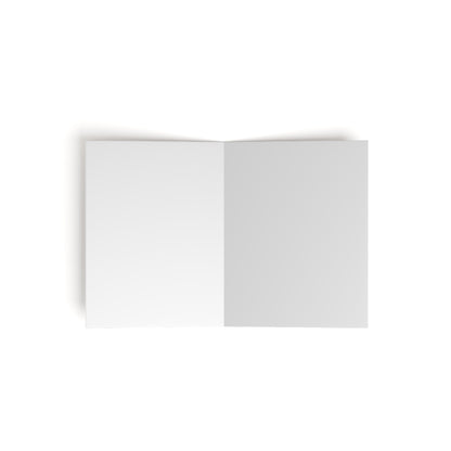 An open blank book or card is shown from above on a white background. Both visible pages are empty and white, with a slight shadow along the spine, evoking a premium stationery feel with its simple and minimalistic appearance.