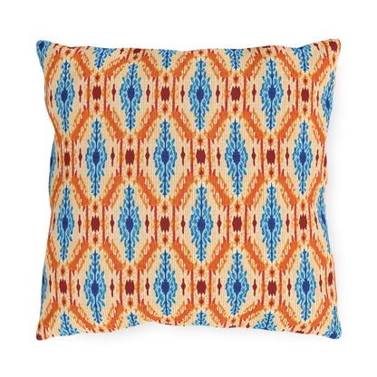 Square decorative outdoor pillow with a cream background, featuring an orange diamond and zigzag pattern, vertical blue accents, and small red details. UV-resistant and water-resistant for lasting style on your patio.