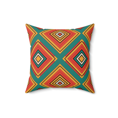 A square pillow featuring vibrant patterns of concentric diamonds in orange, red, yellow, and black on a teal background. Inspired by African-Inspired pillows, its bold, symmetrical design makes it unique decor for any modern space.