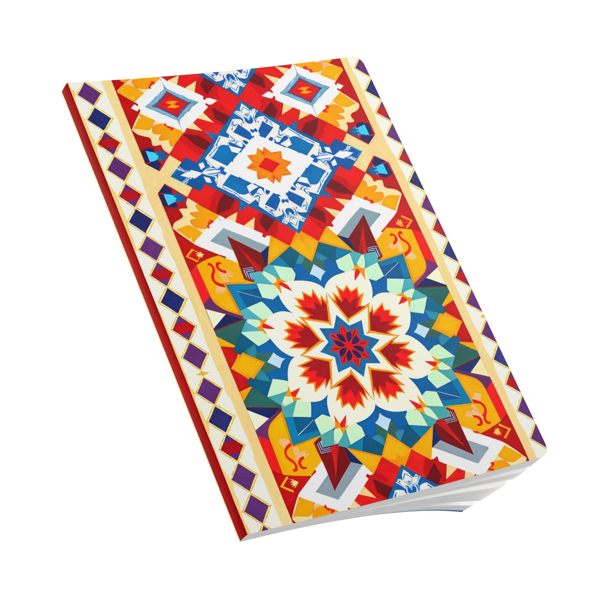 A closed African-inspired journal with a bright, intricate geometric pattern on the cover. Vibrant red, blue, orange, and yellow star motifs pop against a white background—perfect for daily journaling or as a creative journal.