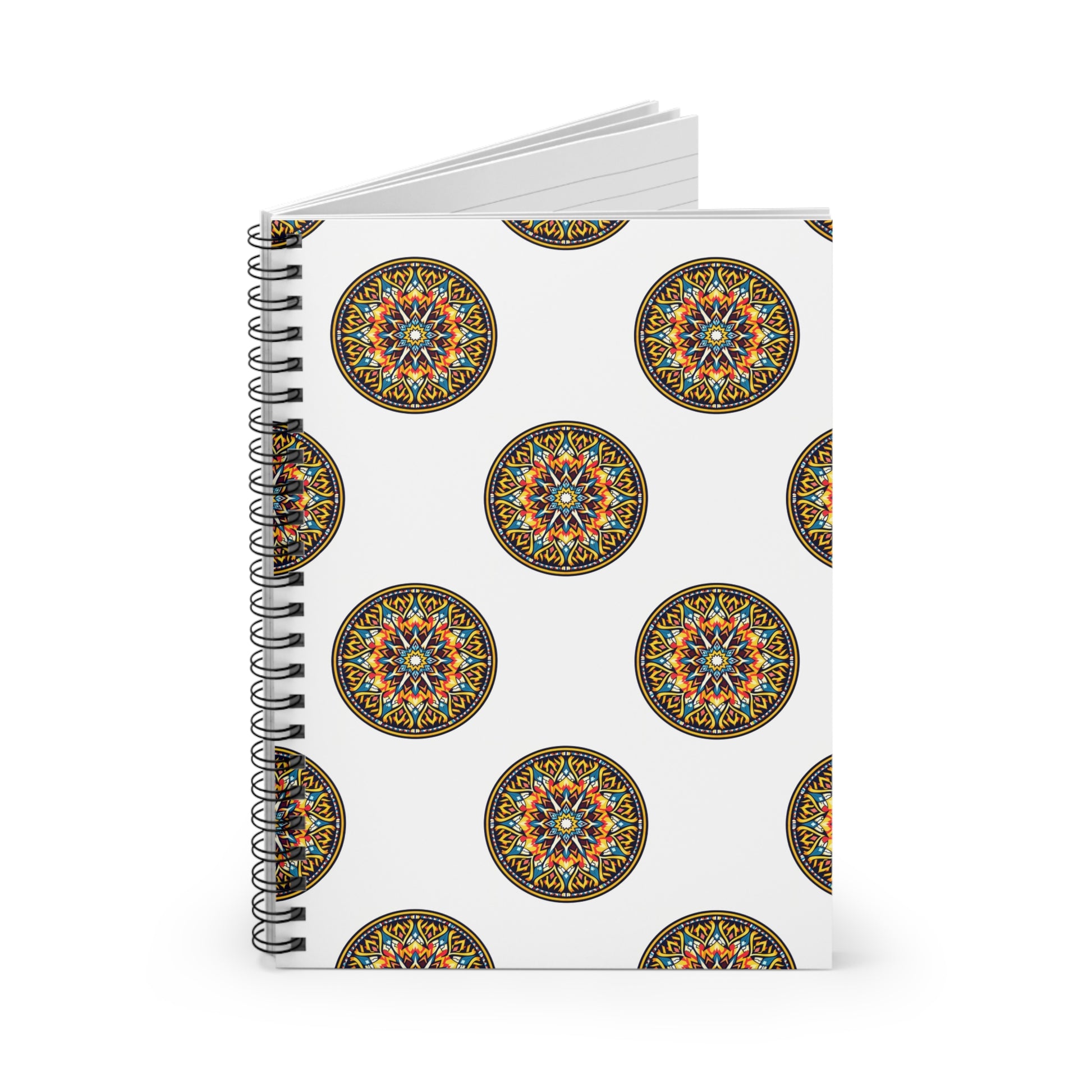 A spiral-bound notebook with a white cover features colorful, intricate circular mandala designs, inspired by culturally inspired designs. Partially open, it offers a premium writing experience on blank white pages. The look is clean and vibrant.
