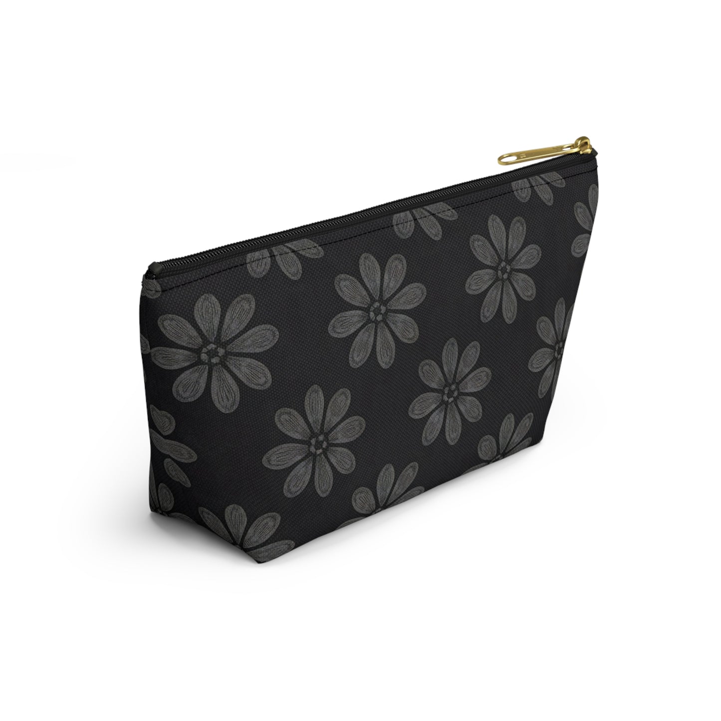 A black zippered T-bottom pouch featuring large, stylized gray flowers with multiple petals in an African-inspired pattern. The cosmetic travel bag has a gold zipper and is photographed against a white background at a slight angle.