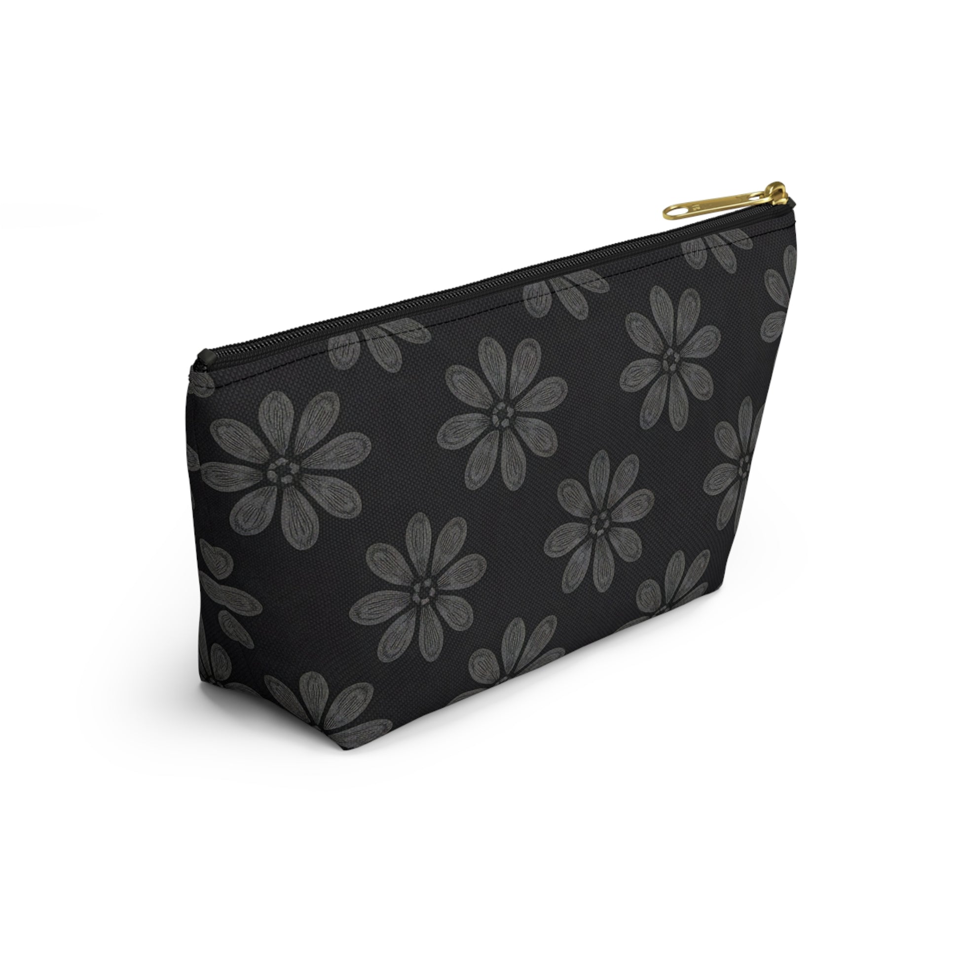 A black zippered T-bottom pouch featuring large, stylized gray flowers with multiple petals in an African-inspired pattern. The cosmetic travel bag has a gold zipper and is photographed against a white background at a slight angle.