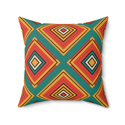 A square throw pillow featuring a bold, African-inspired geometric pattern of concentric diamonds in orange, red, yellow, and black on teal. The vibrant patterns create a striking and modern look for unique decor.