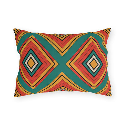 Rectangular outdoor pillow with a bold, geometric pattern in red, orange, teal, black, and beige. Made from weatherproof materials, this customizable design adds vibrant style to your space with its symmetrical diamond shapes on a white background.