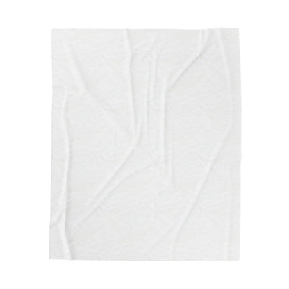 A plain white, rectangular velveteen blanket with subtle wrinkles and creases is laid flat against a white background. The fabric appears soft and lightweight, with faint shadows emphasizing its texture and folds.