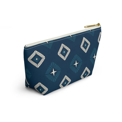 A blue zippered cosmetic travel bag featuring African-inspired patterns of white and teal diamonds and star shapes. The modern, geometric design covers the entire surface, while the gold zipper and T-bottom pouch shape make it stylish and functional.