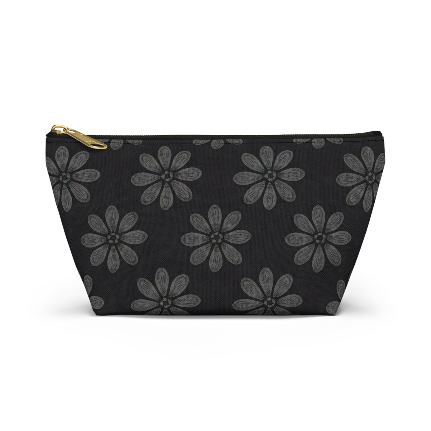 A black cosmetic travel bag with a gold zipper, featuring African-inspired patterns of large, gray, six-petaled flowers evenly spaced across the solid black T-bottom pouch. Displayed upright against a white backdrop.