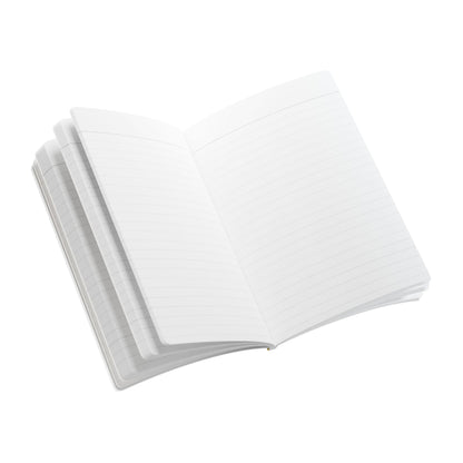 An open, blank, lined notebook with a few pages slightly fanned out, viewed from above on a white background—perfect for daily journaling or capturing memories in your travel diary. The crisp, white pages await your thoughts and stories.