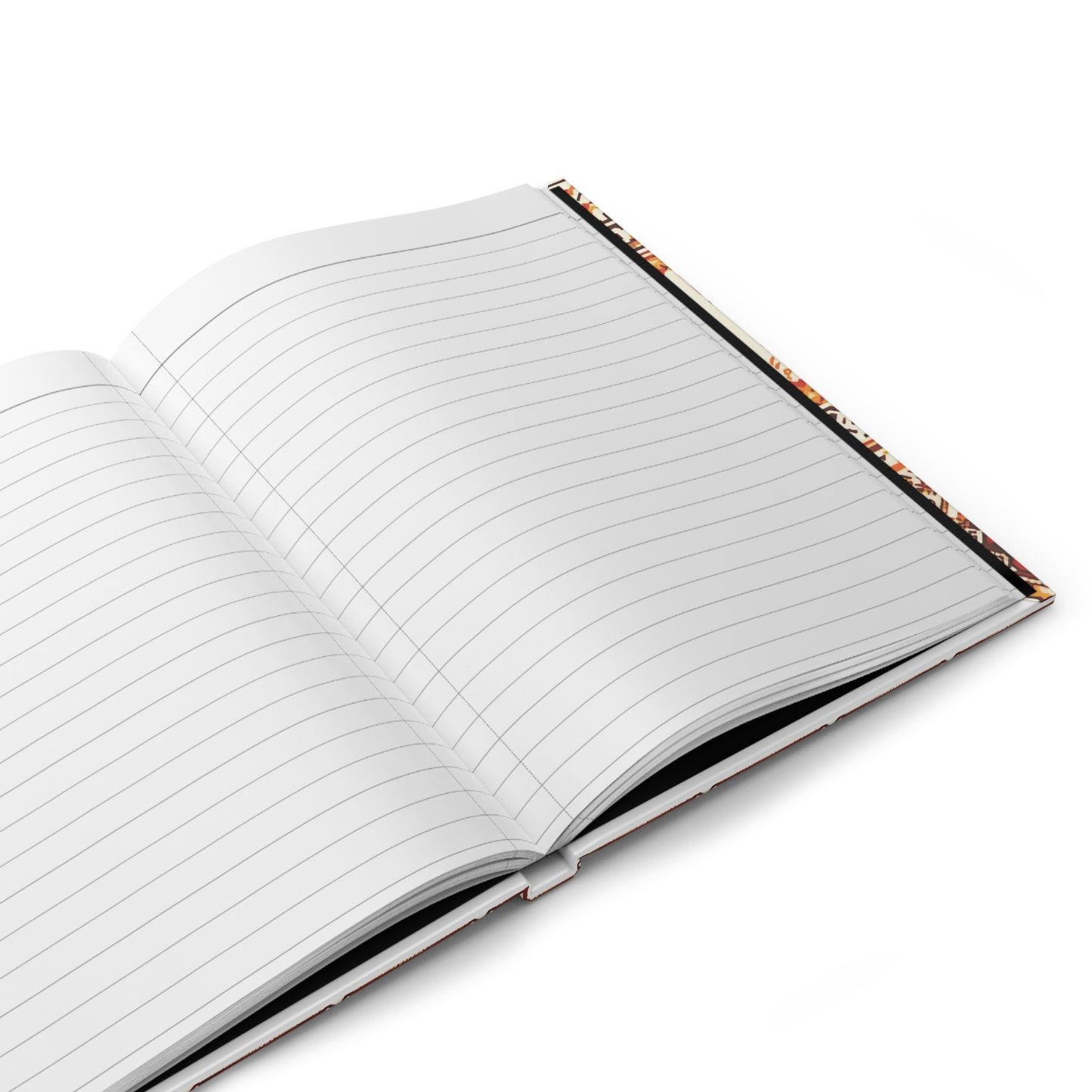 An African-inspired notebook with a vibrant tribal pattern lies open on a white surface, its hardcover angled slightly to the right. Colorful inner edges peek out, and the blank wide-ruled pages are ready for writing.