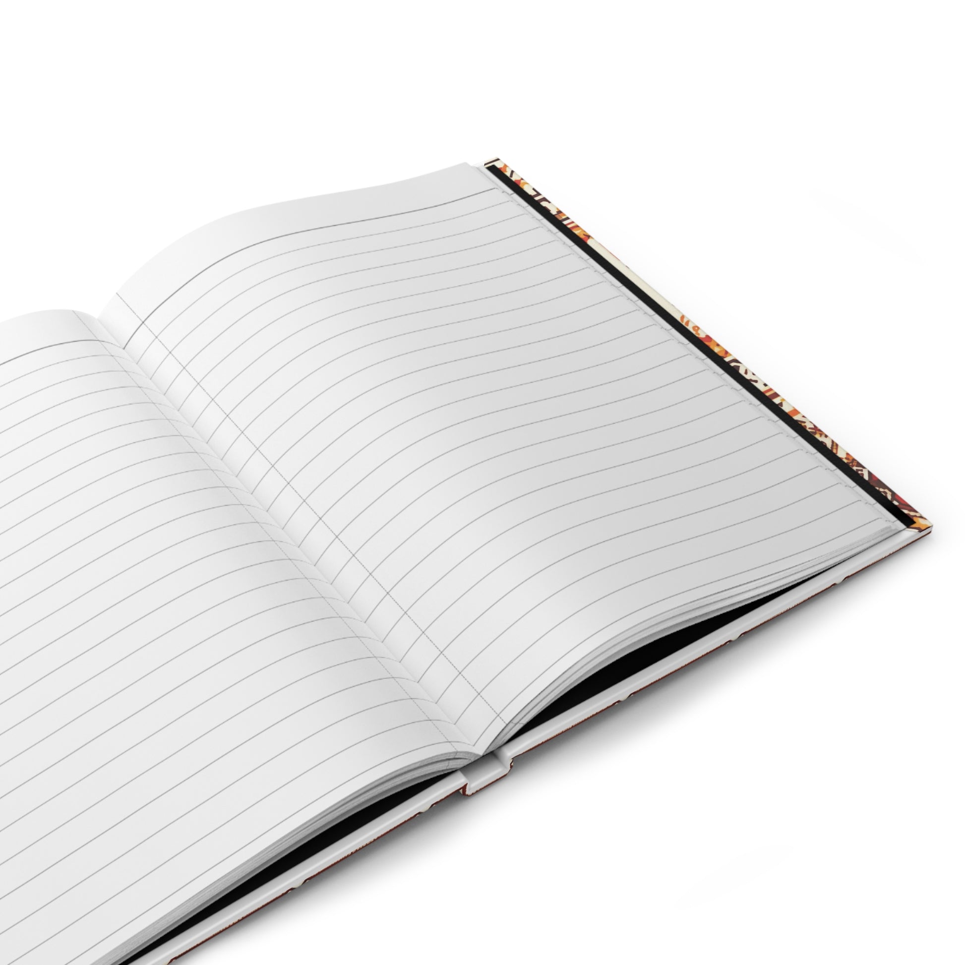 An African-inspired notebook with a vibrant tribal pattern lies open on a white surface, its hardcover angled slightly to the right. Colorful inner edges peek out, and the blank wide-ruled pages are ready for writing.